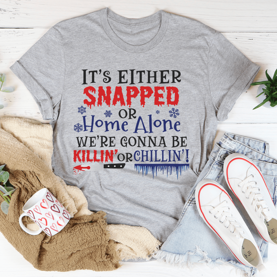 Gray Christmas T-shirt with large red and blue holiday slogan graphic.
