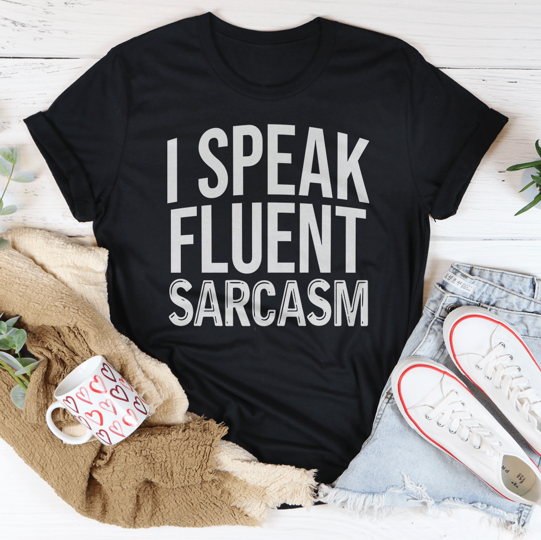 Black heather crew-neck T-shirt featuring bold white 'I SPEAK FLUENT SARCASM' text