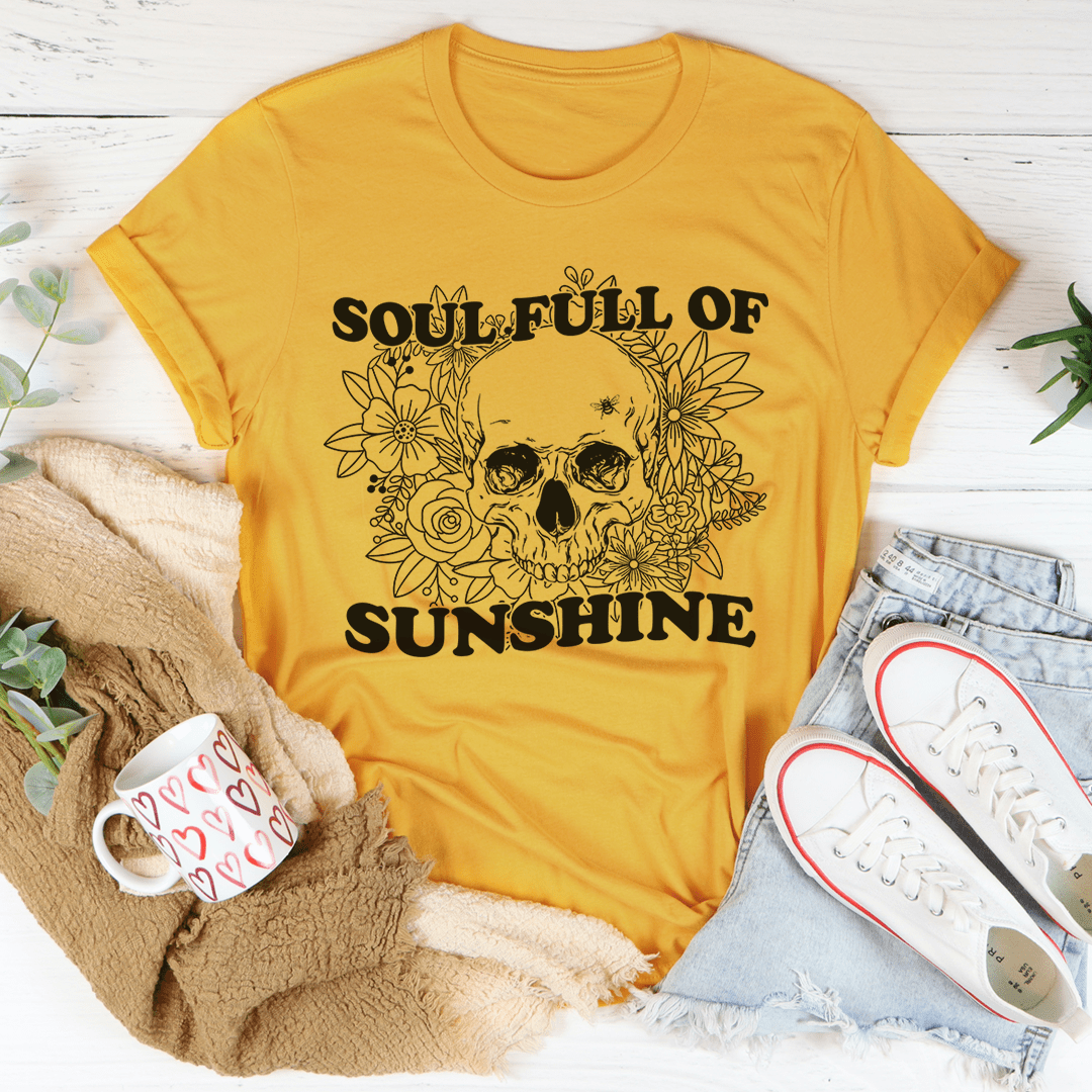 Golden yellow T-shirt with floral wreath skull graphic, crew neck.