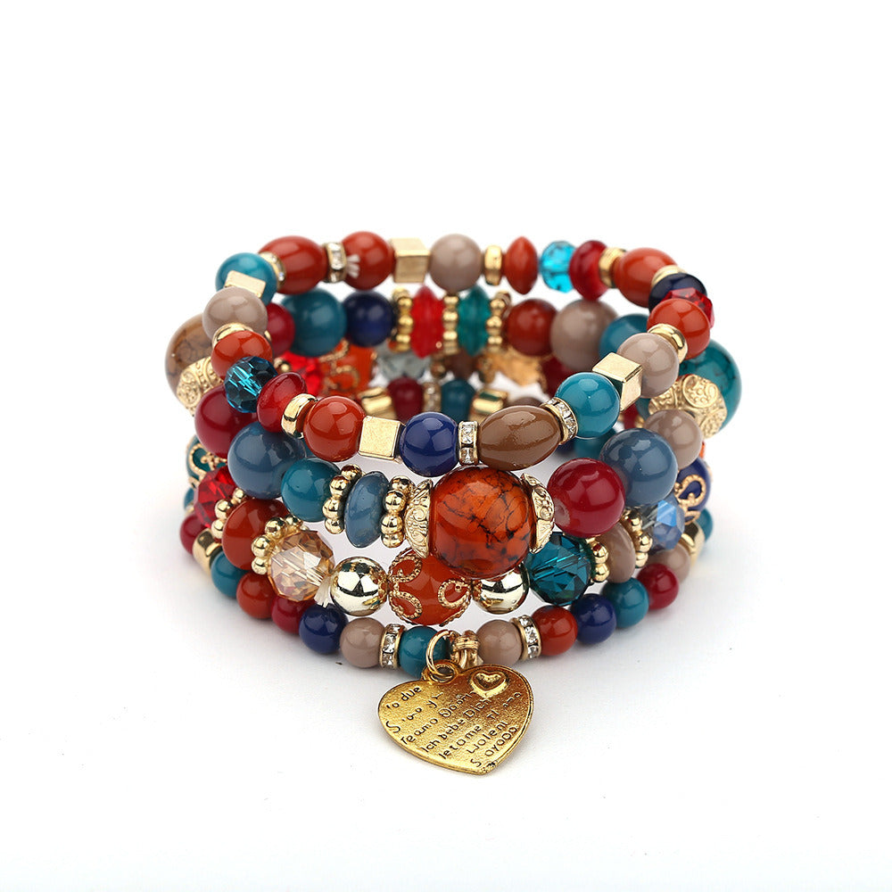 Heart charm layered bead bracelet set with multicolor beads and gold-tone heart pendant