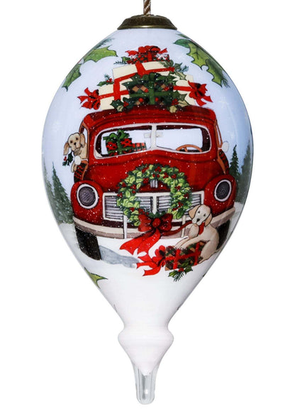 Hand-painted glass hanging ornament: teardrop with red holiday truck, gifts, wreaths.