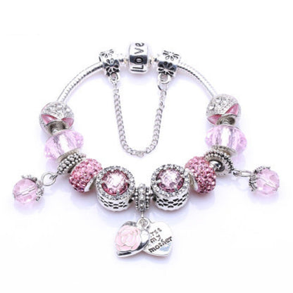 Silver charm bracelet with pink-purple rhinestone beads and heart tag pendant
