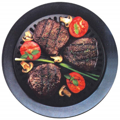Round smokeless grill with grilled steak and tomato on black grates