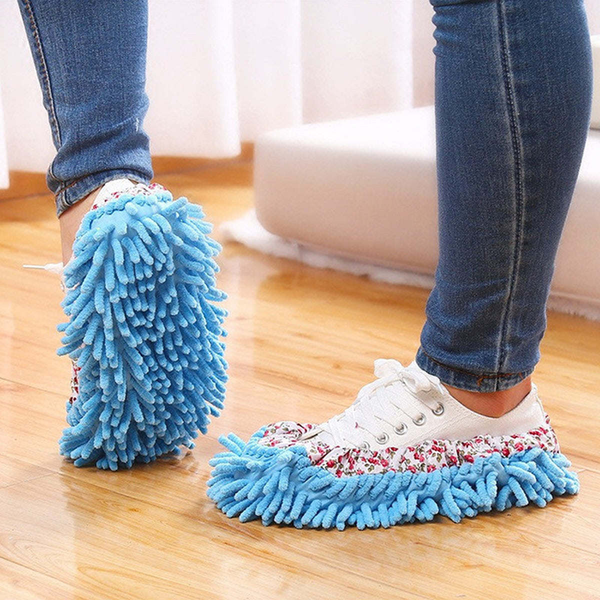 Blue slip-on mop slippers with fabric lining and fringed microfiber sole.