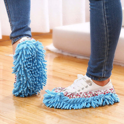 Blue slip-on mop slippers with fabric lining and fringed microfiber sole.