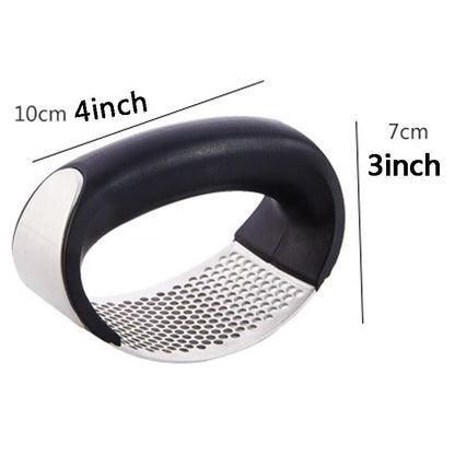 Compact arc-shaped garlic press with black handle and stainless perforated base