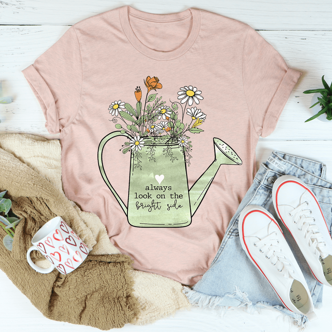 Dusty pink crewneck T-shirt with floral watering can graphic and 'bright side' text