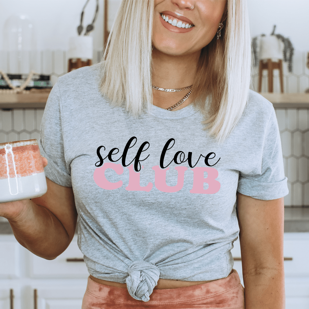 Athletic heather crewneck T-shirt with 'self love club' graphic and front knot