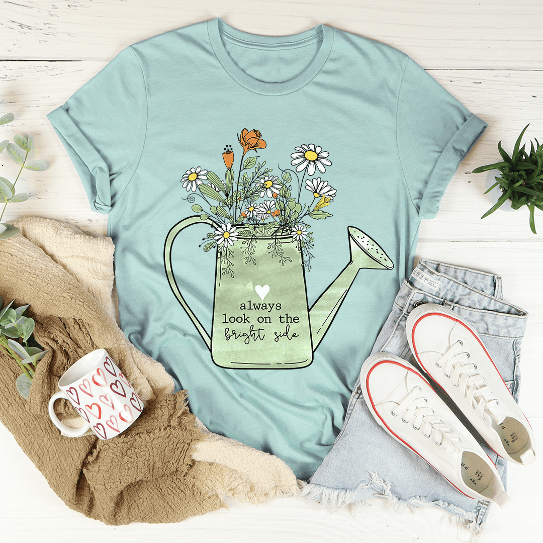 Dusty blue graphic t-shirt with floral watering-can and 'bright side' quote