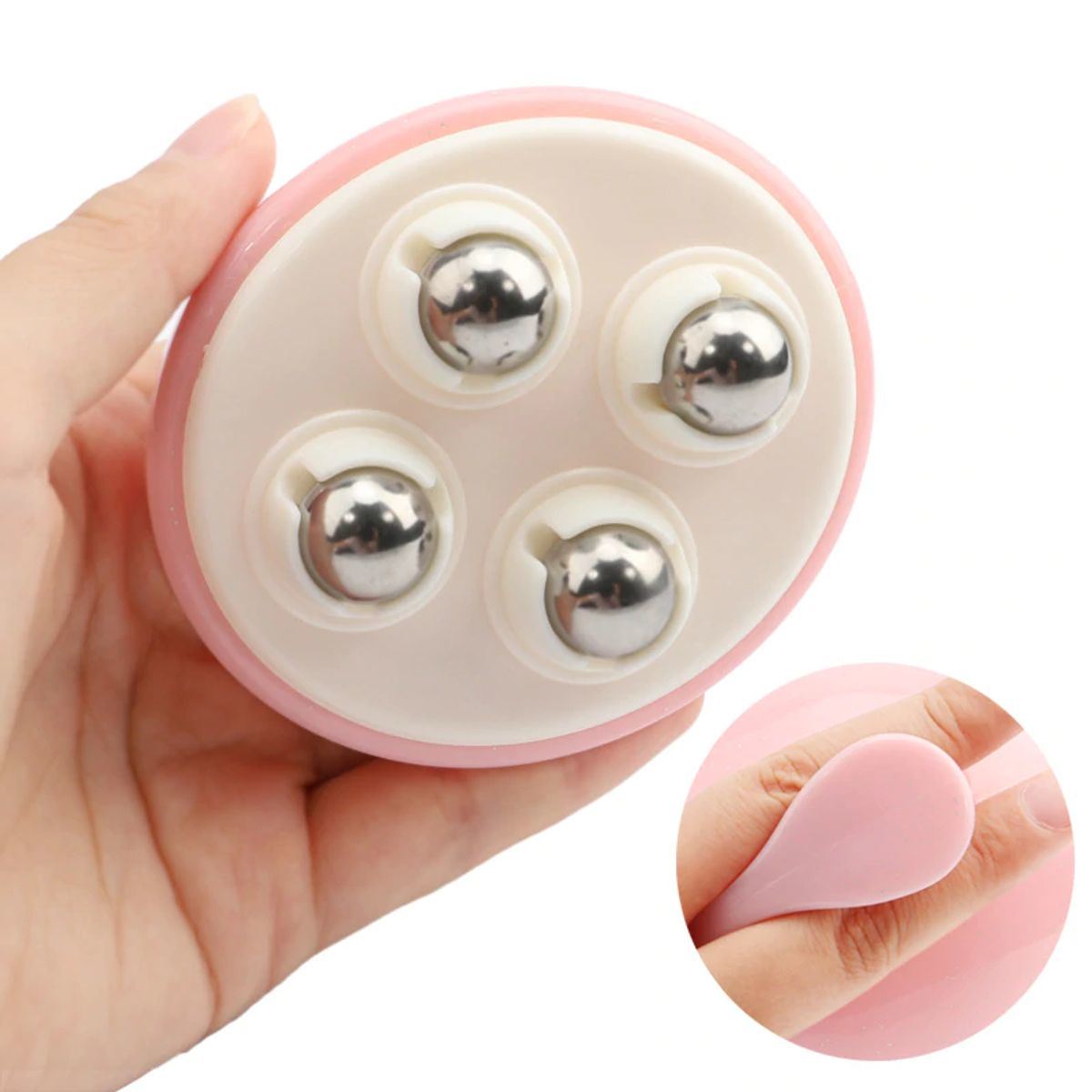 Pink rolling body massager underside with four chrome massage beads on disk