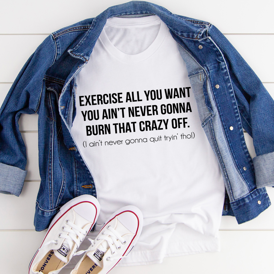 White graphic t-shirt with “Exercise all you want” slogan over denim jacket
