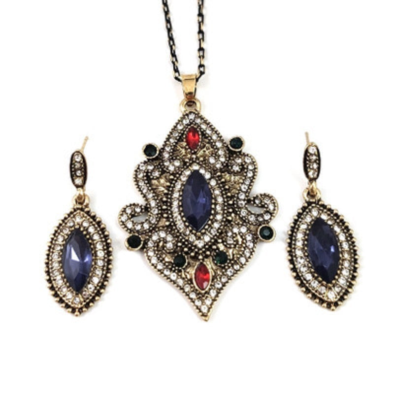 Gold-tone pendant necklace with blue marquise stones and matching blue drop earrings