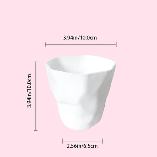 White tapered pen holder cup for desktop stationery, open top.