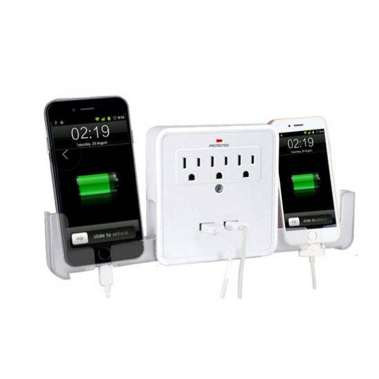 White wall power adapter with three AC outlets and dual USB ports beside two phones