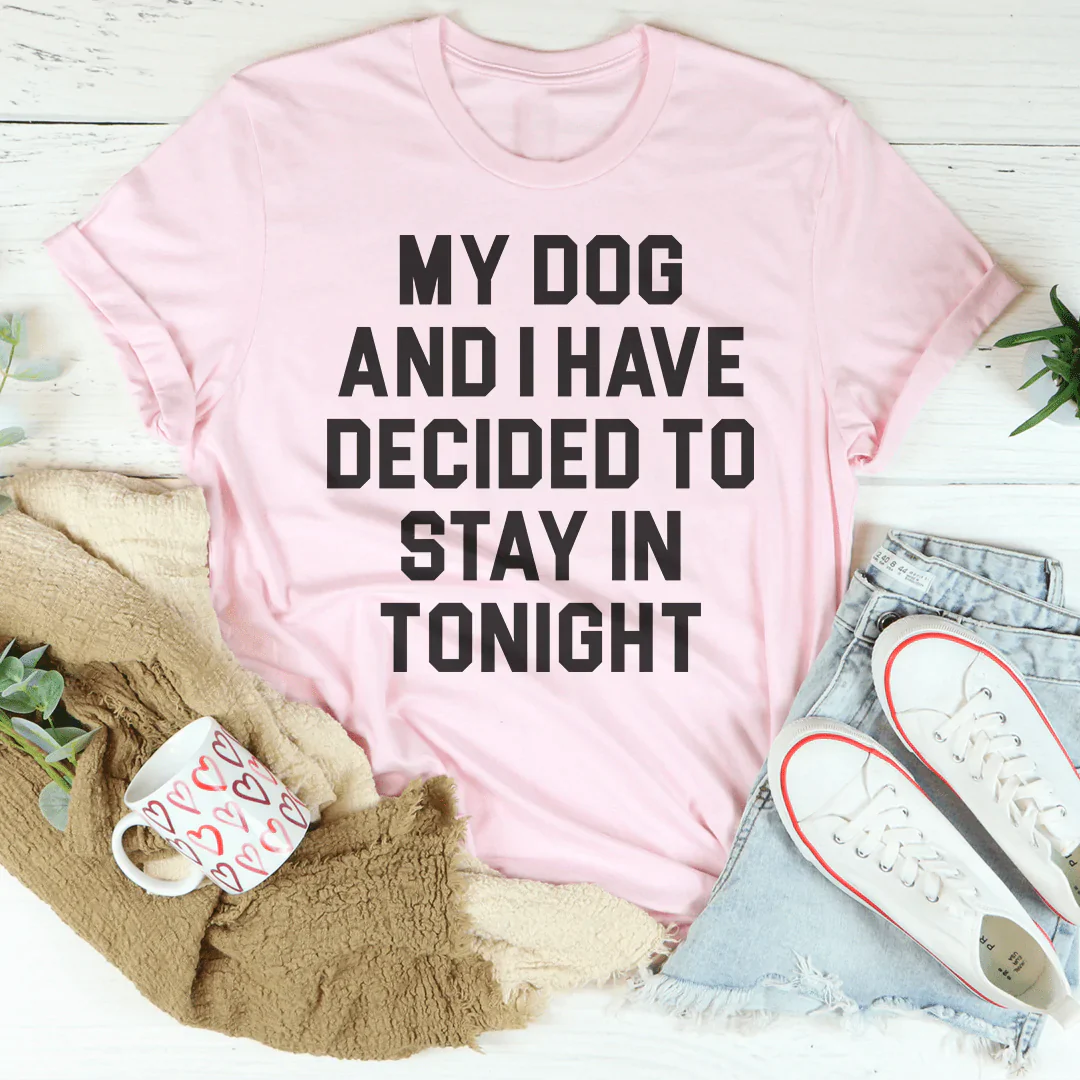 Light pink crew-neck T-shirt laid flat with 'MY DOG...STAY IN TONIGHT' text