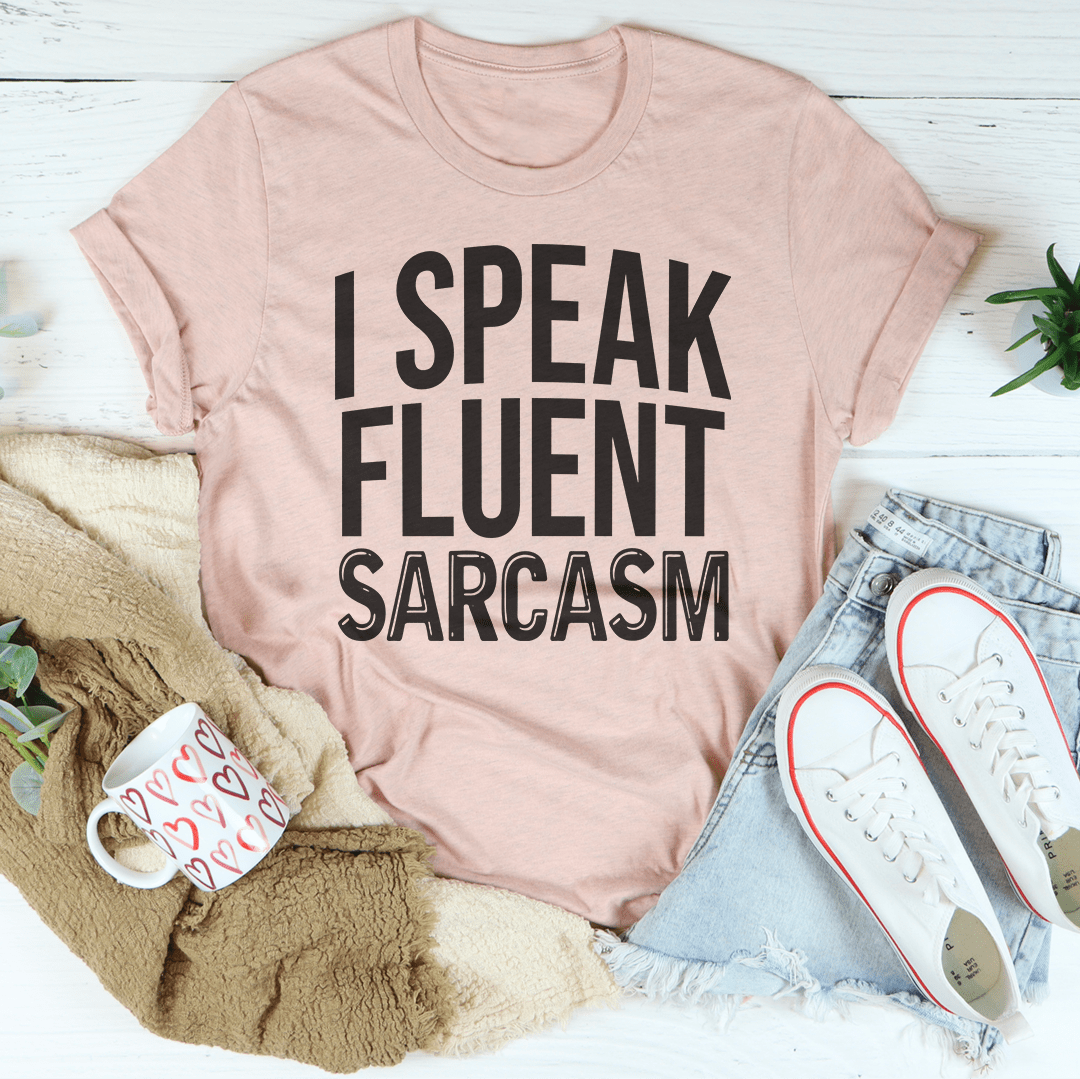 Peach heather crew-neck T-shirt with large black 'I SPEAK FLUENT SARCASM' graphic
