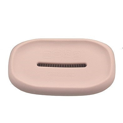 Pink silicone soap dish base with rectangular drainage slot and embossed markings.