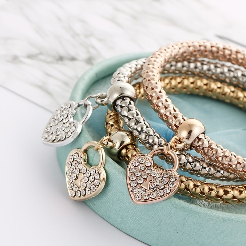 Multicolor rhinestone chain bracelet with heart charms and gold-toned clasp bead