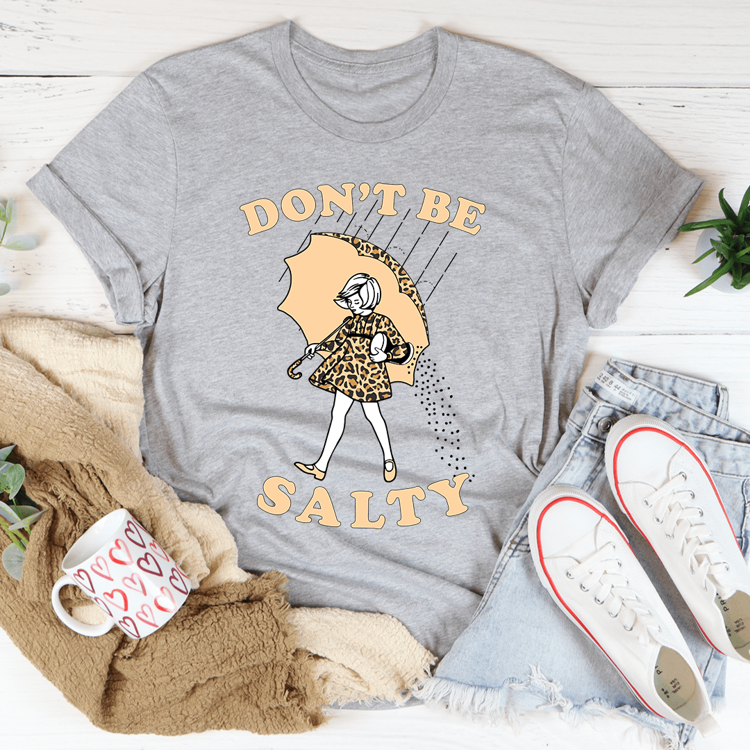 Heather gray V-neck T-shirt with umbrella girl graphic and text 'DON'T BE SALTY'