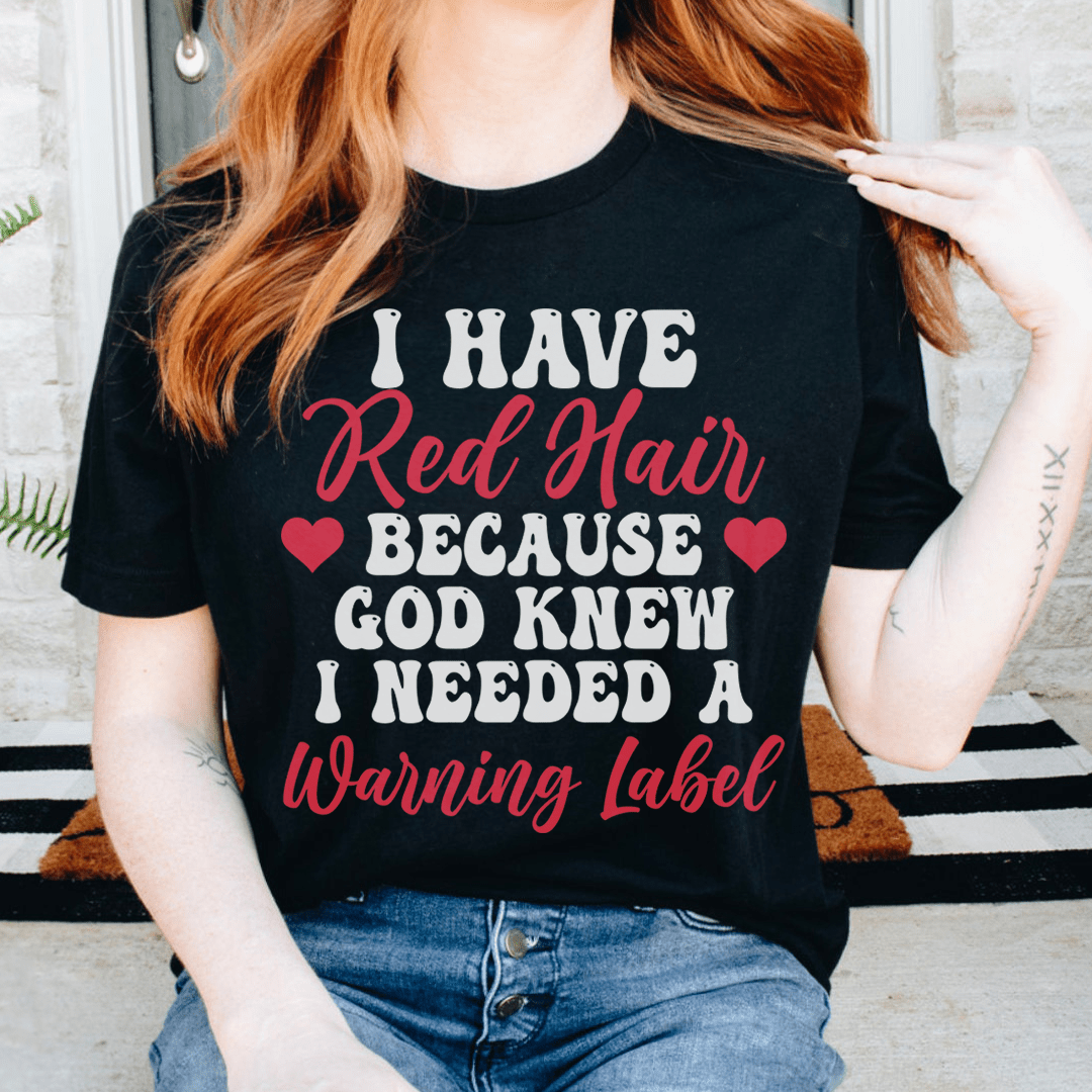 Black graphic tee with red hair quote and warning label typography