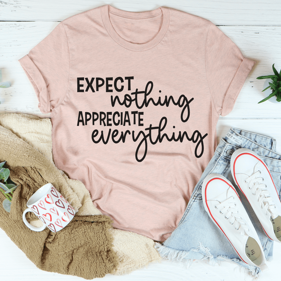 Mauve crewneck t-shirt with centered white-and-black typographic slogan