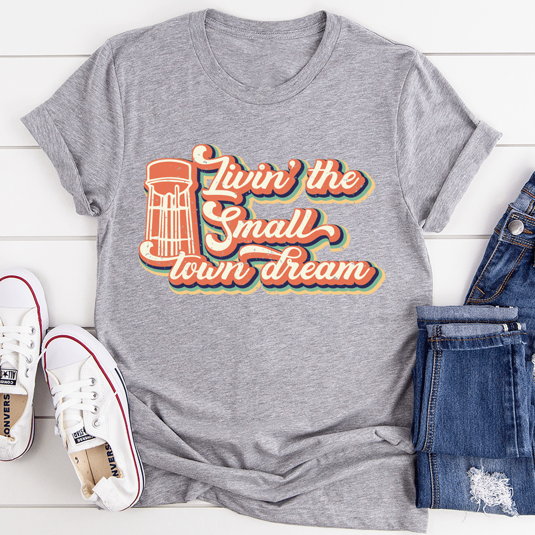 Grey T-shirt with colorful lighthouse-style "Livin' the Small Town dream" print