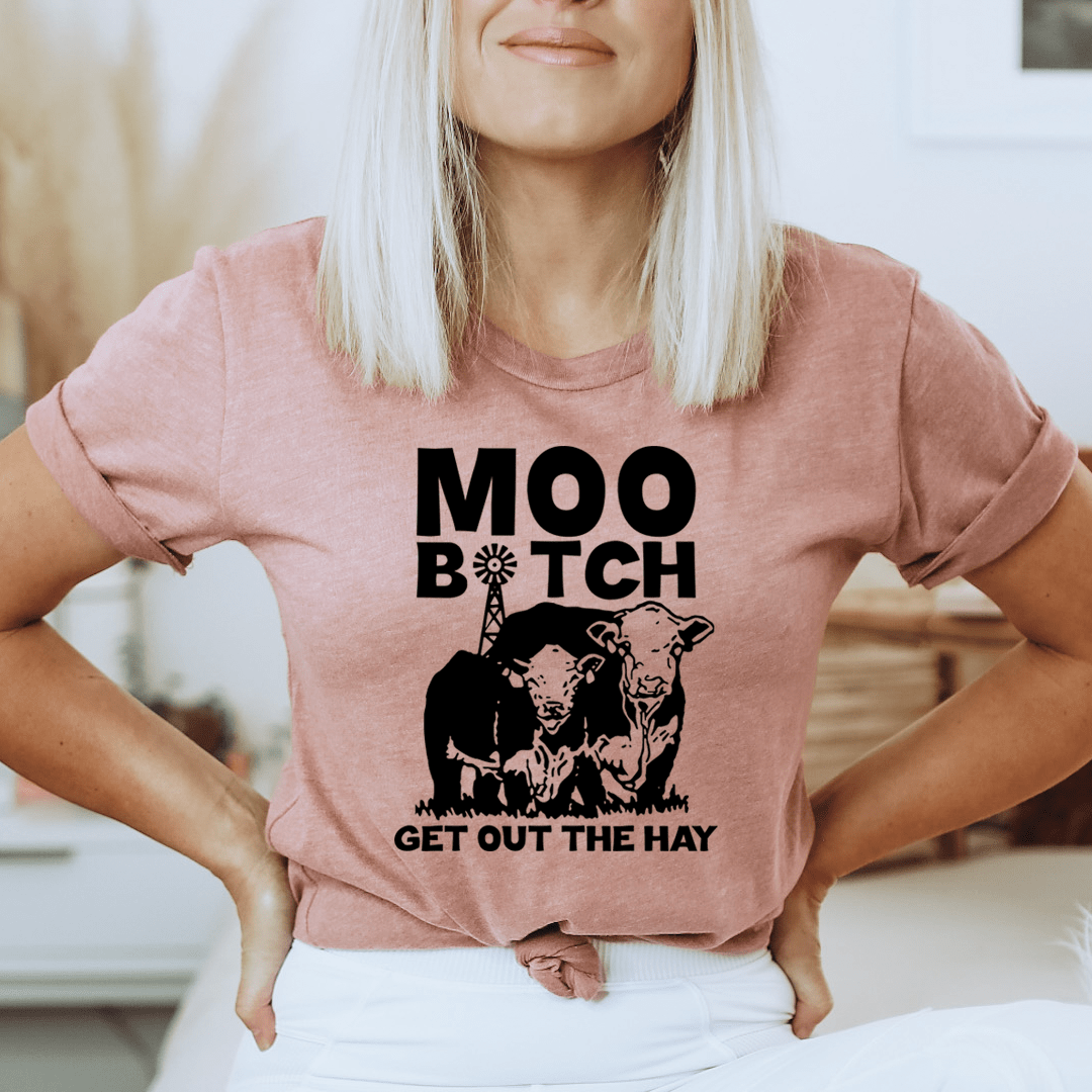 Mauve pink T-shirt with cow graphic and bold black 'Get out the hay' text