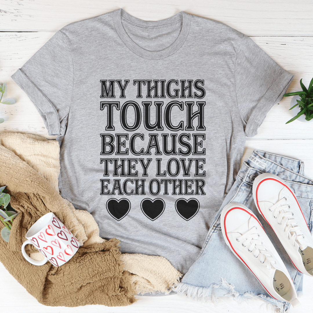 Heather gray graphic T-shirt with 'MY THIGHS TOUCH' text and three heart icons.