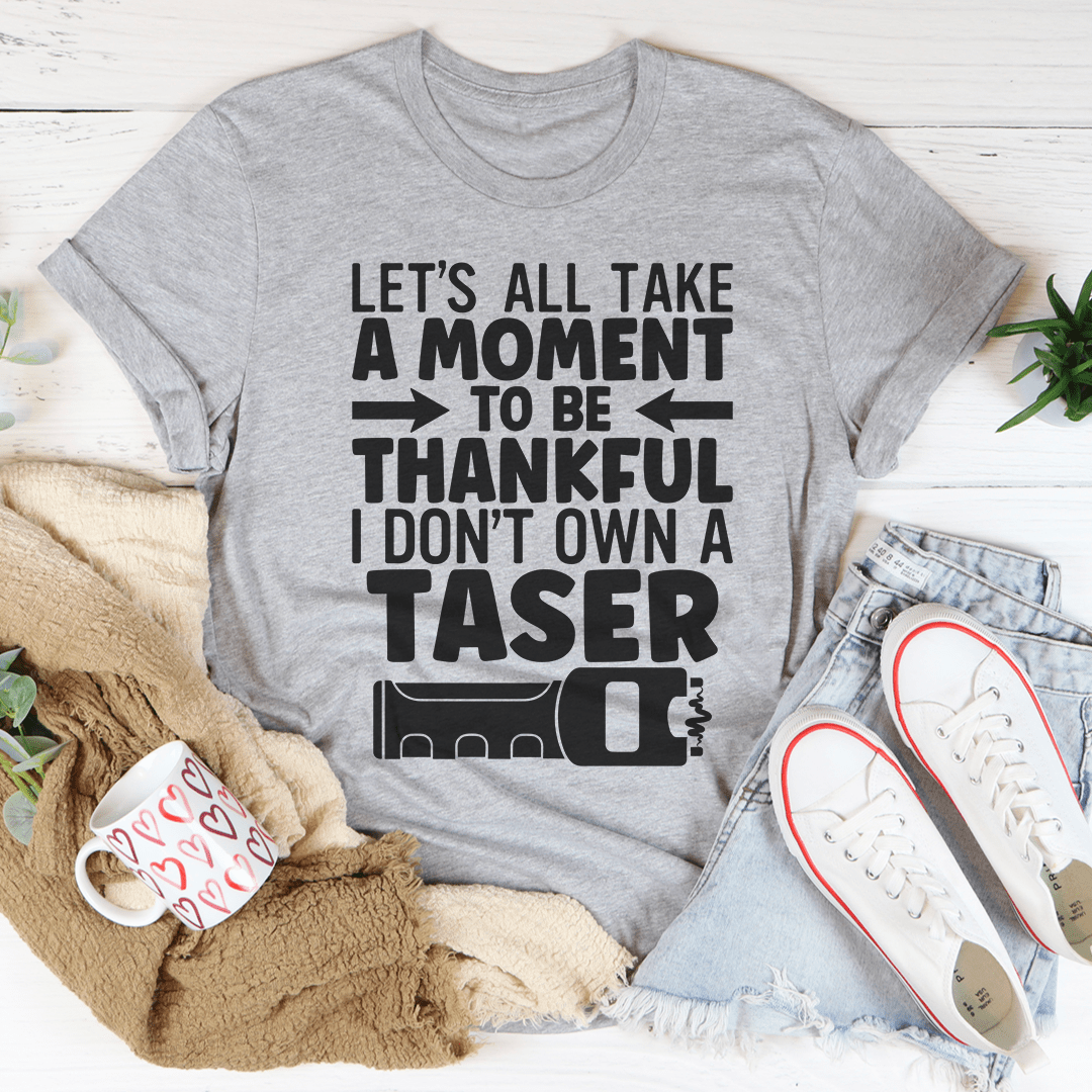 Heather gray T-shirt with large black type: LET'S ALL TAKE A MOMENT TO BE THANKFUL