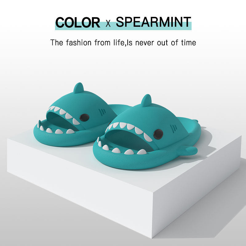 Shark-shaped EVA slides, mint green, side-by-side with white tooth trim and fin tops