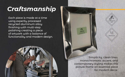 Silver picture frame with smooth metal edges and tabletop design