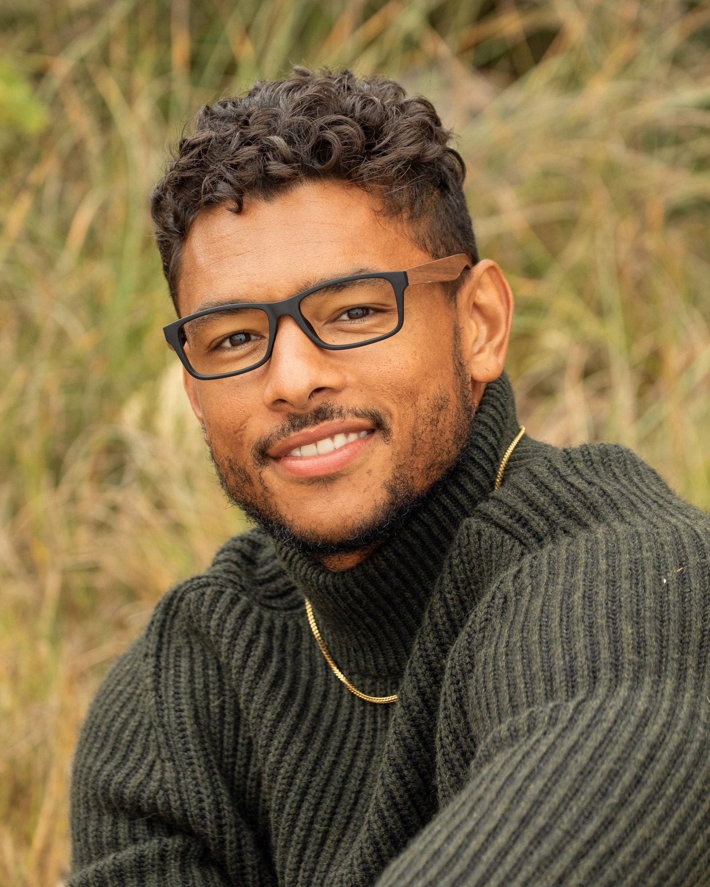 Blue light reading glasses on a man with dark square frames and side detail