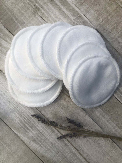 White round reusable facial pads, overlapping soft circles.
