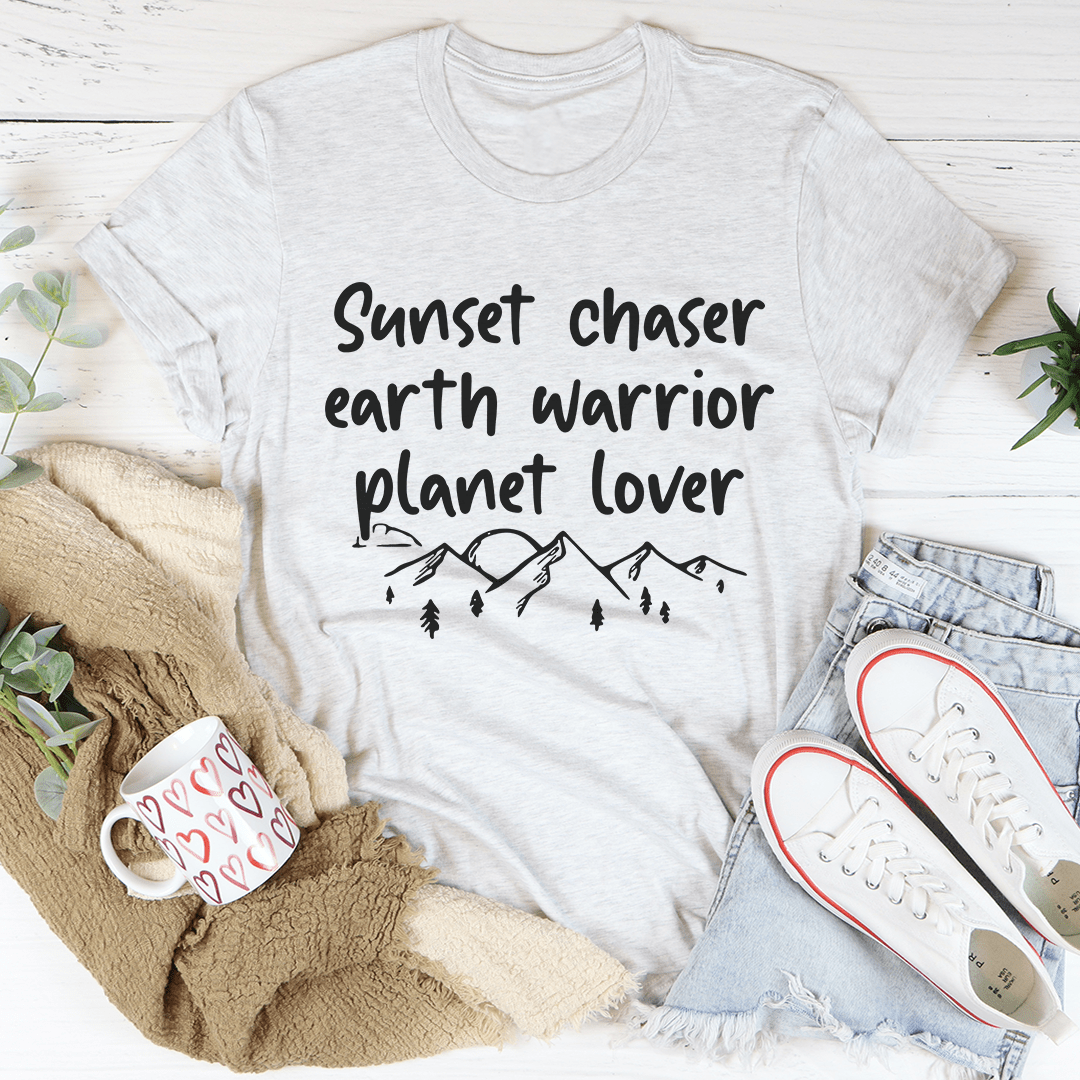 White crewneck T-shirt featuring 'Sunset chaser earth warrior planet lover' planet graphic