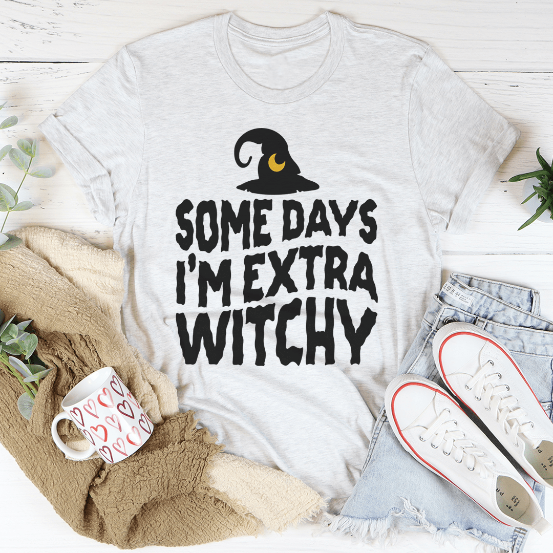 Light heather gray witchy graphic t-shirt with witch hat and slogan text