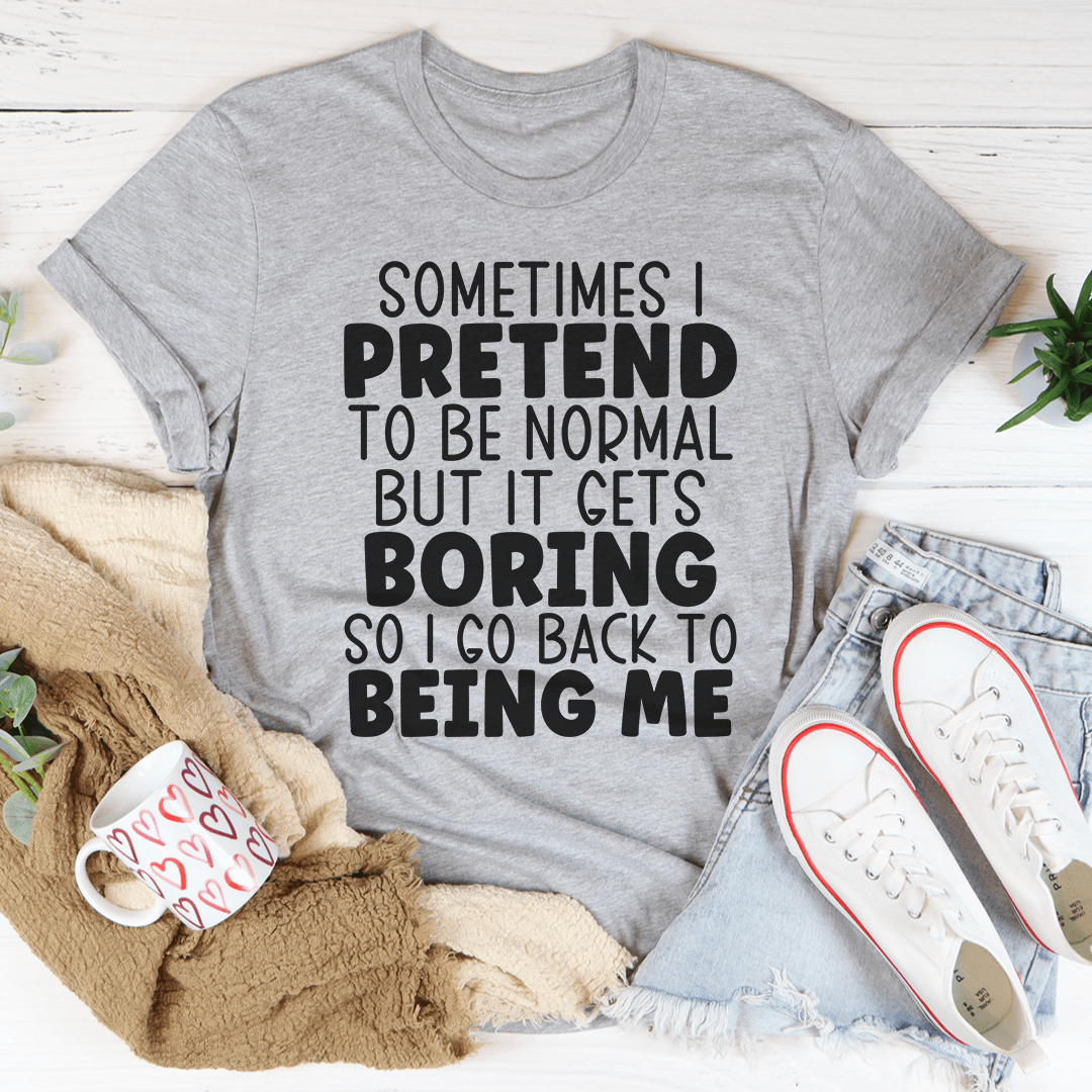 Heather gray graphic t-shirt with bold 'Pretend to be normal' text