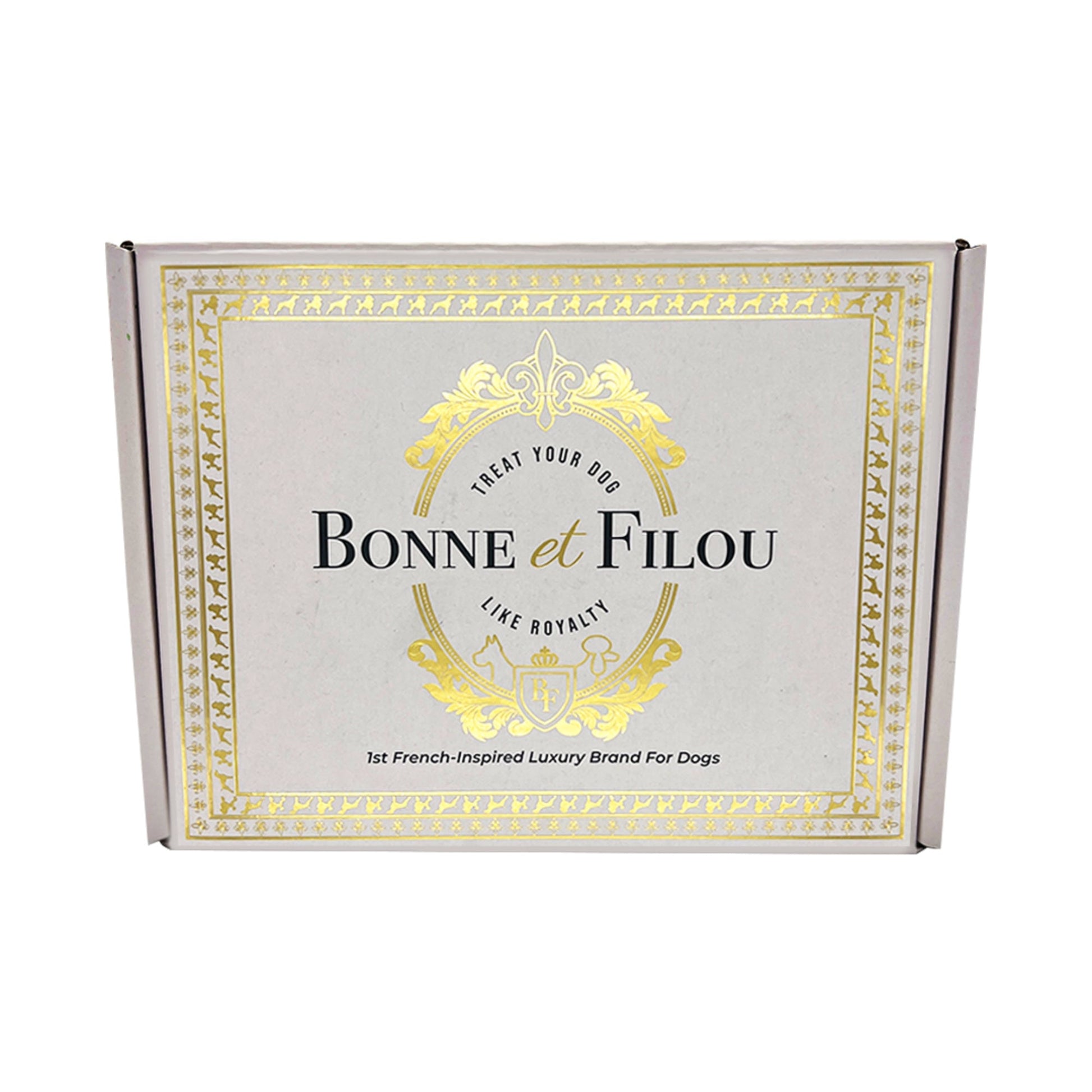 Bonne et Filou dog treats gift box with gold crest logo on gray.