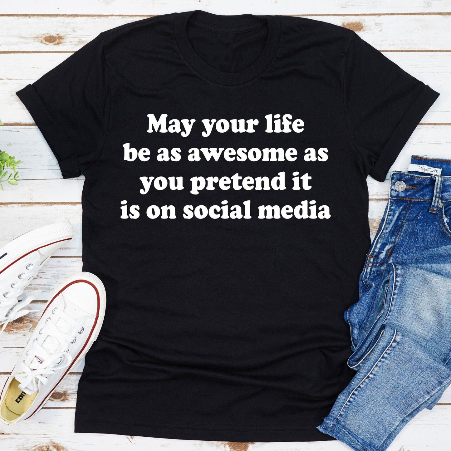 Black crewneck T-shirt with white slogan graphic