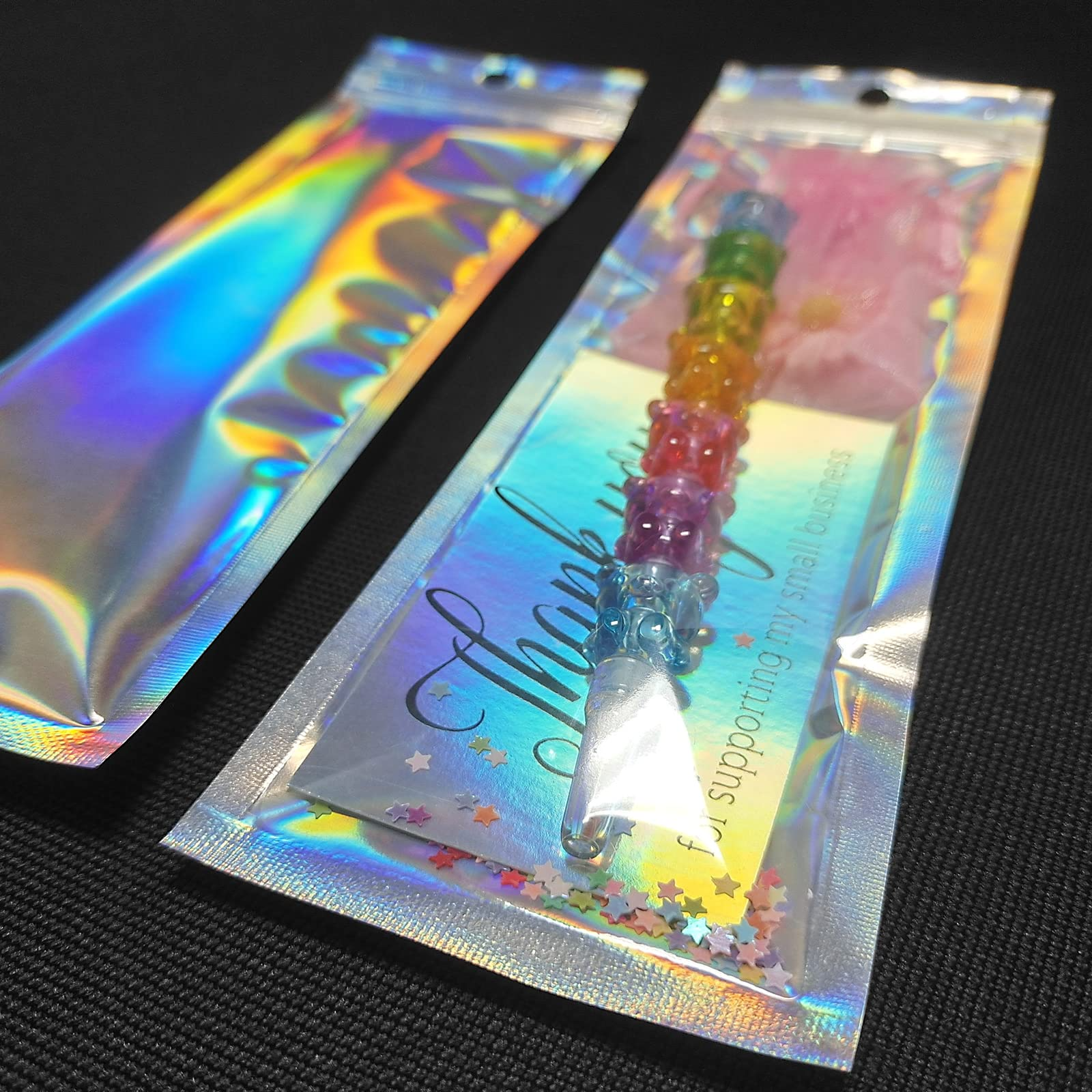 Holographic foil resealable pouch bag with tear notch and zipper seal
