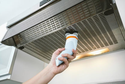 Cordless spin scrub brush held up to clean a vent grille