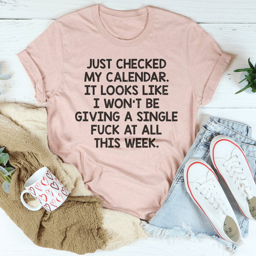 Blush pink crewneck T-shirt with bold black quote text