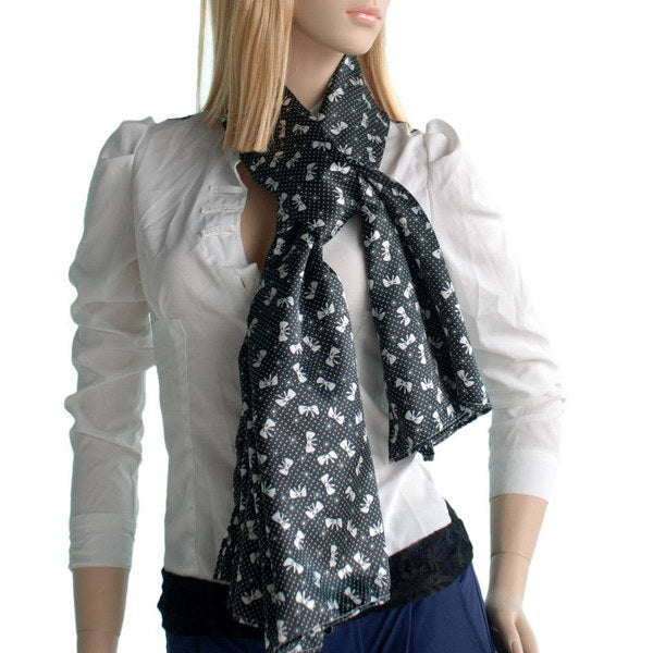 Black silk scarf bowknot with white floral dot print, worn around neck