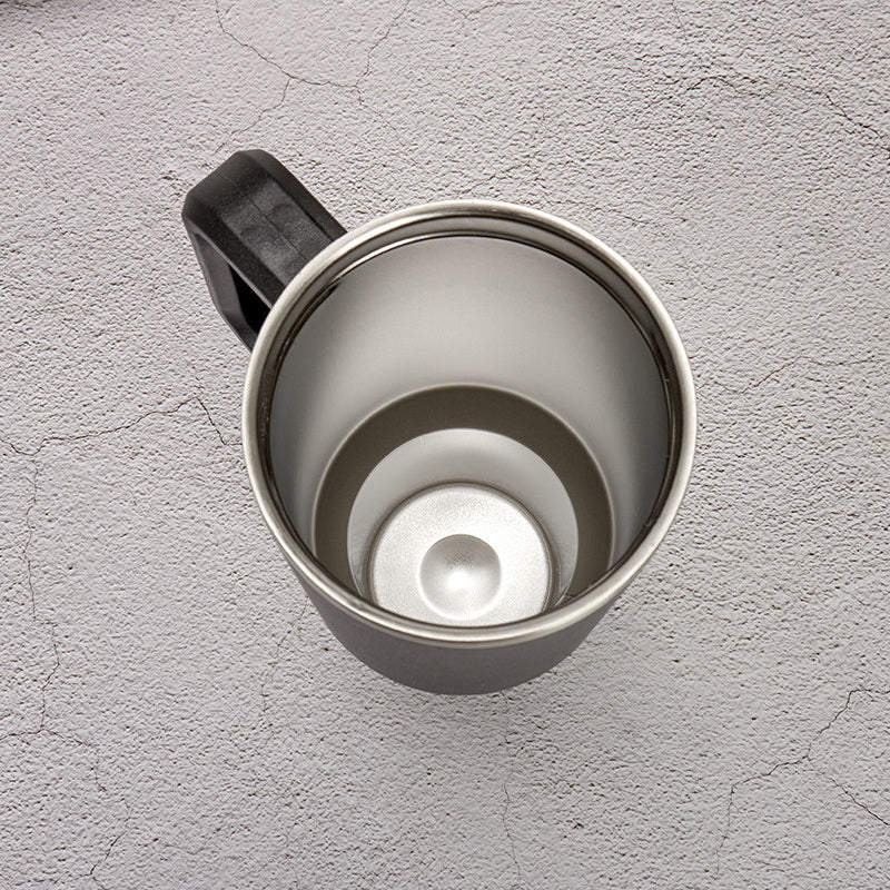 Dark travel tumbler with handle and open lid, stainless interior, top view