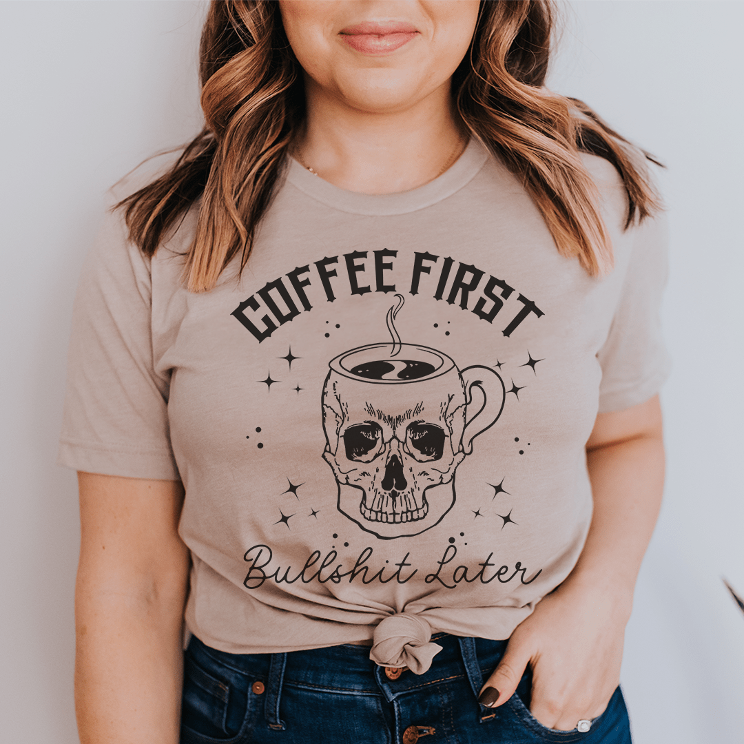 Tan crew-neck T-shirt with coffee skull graphic and “Bullshit Later” text