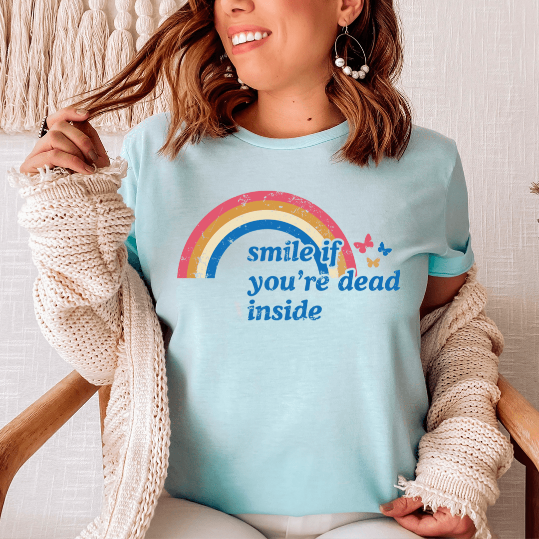 Light blue graphic T-shirt with rainbow "smile if you're dead inside" print