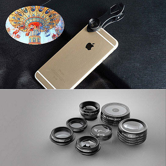 Group of five clip-on smartphone camera lenses arranged on a dark surface