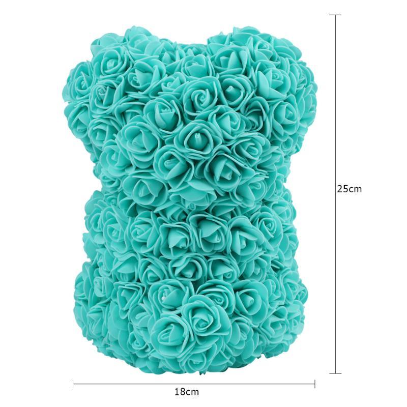 Teal rose teddy bear made of layered rosettes, shown from the front
