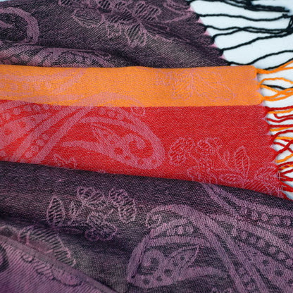 Paisley pashmina scarf fabric with purple, orange and pink bands and multicolor fringes