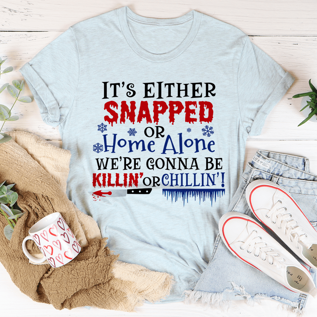Light blue crewneck short-sleeve t-shirt with festive multicolor 'Snapped' text graphic