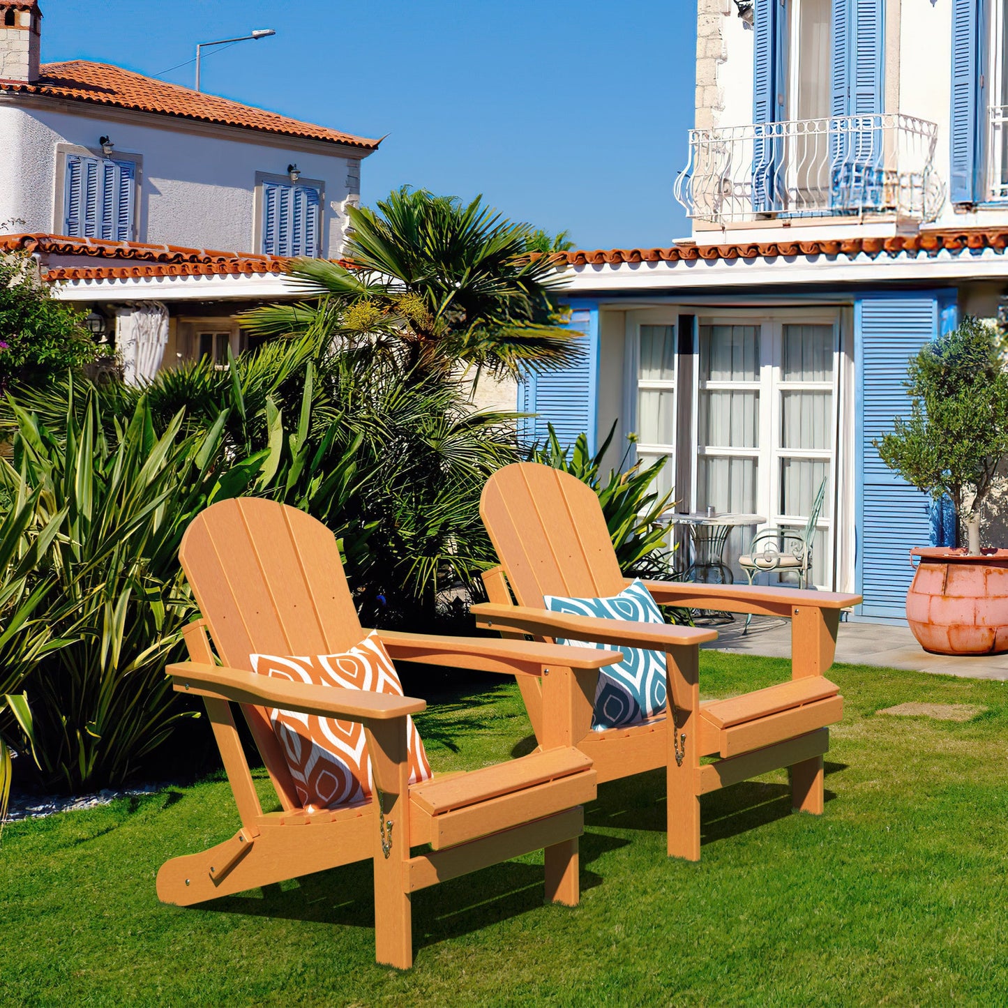 Set of two orange folding Adirondack chairs, slatted backs and seats